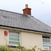 Defender® Chimney Pot Spikes protecting chimney pot from seagulls and pigeons