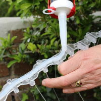 Silicone being applied to the base of Defender® Wide Stainless Steel Bird Spikes using a caulking gun