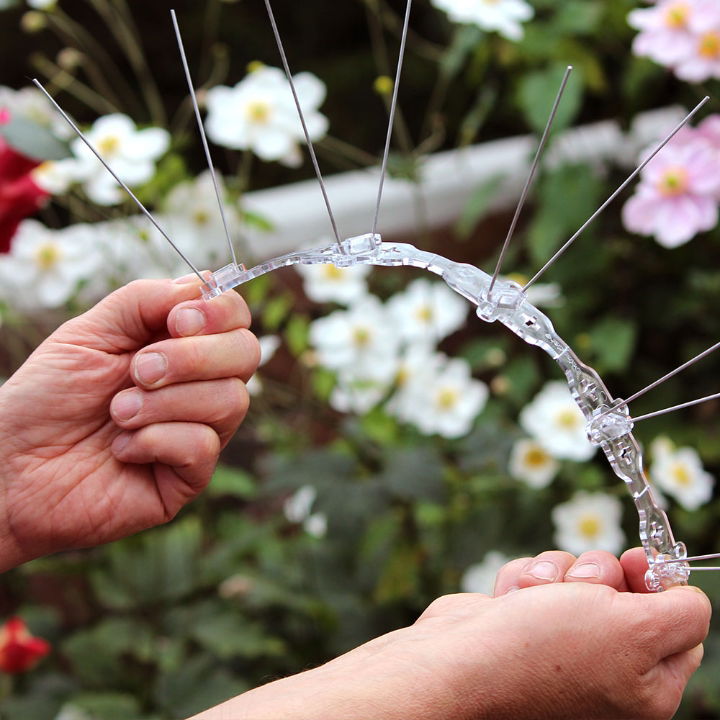 Defender® Narrow Steel Bird Spikes being flexed along the  length, they are flexible for curved surfaces