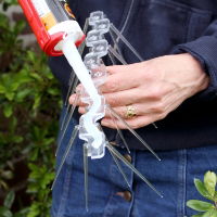 Applying Defender® Fixing Silicone to the base of a Wide Plastic Pigeon Spikes ready for installation