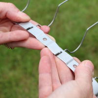 Defender® Chimney Pot Spikes have a metal stainless steel strap that clips around the pot