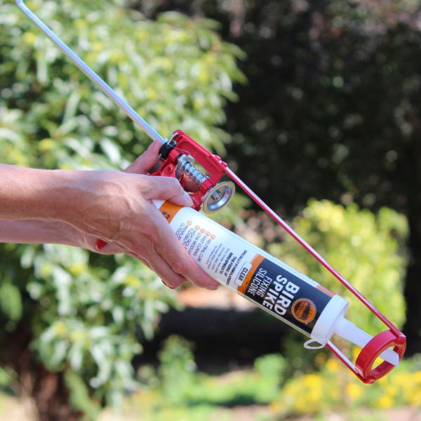 Heavy Duty Professional Skeleton Gun - Defender® Silicone Tube  being inserted into the caulking gun