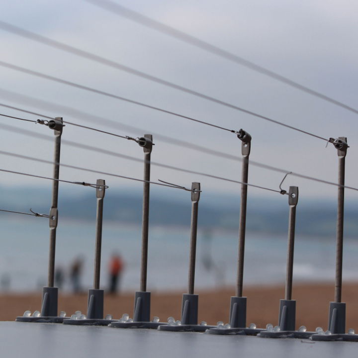 Defender® Bird Post and Wire Holders wires installed on a ledge using Defender® Fixing Silicone